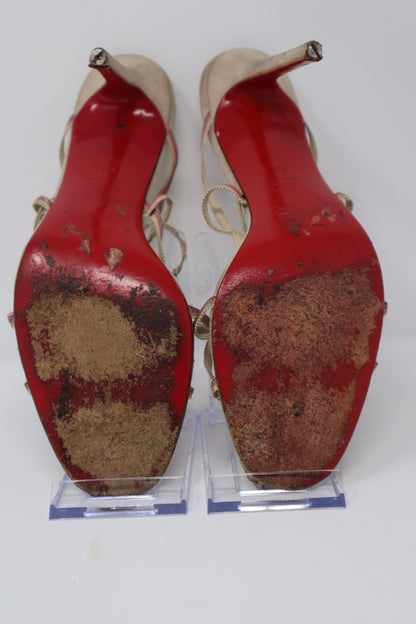 Christian Louboutin Sandals in fair condition, featuring leather straps and the signature red sole. These sandals require new heel taps but retain their elegant, designer appeal.