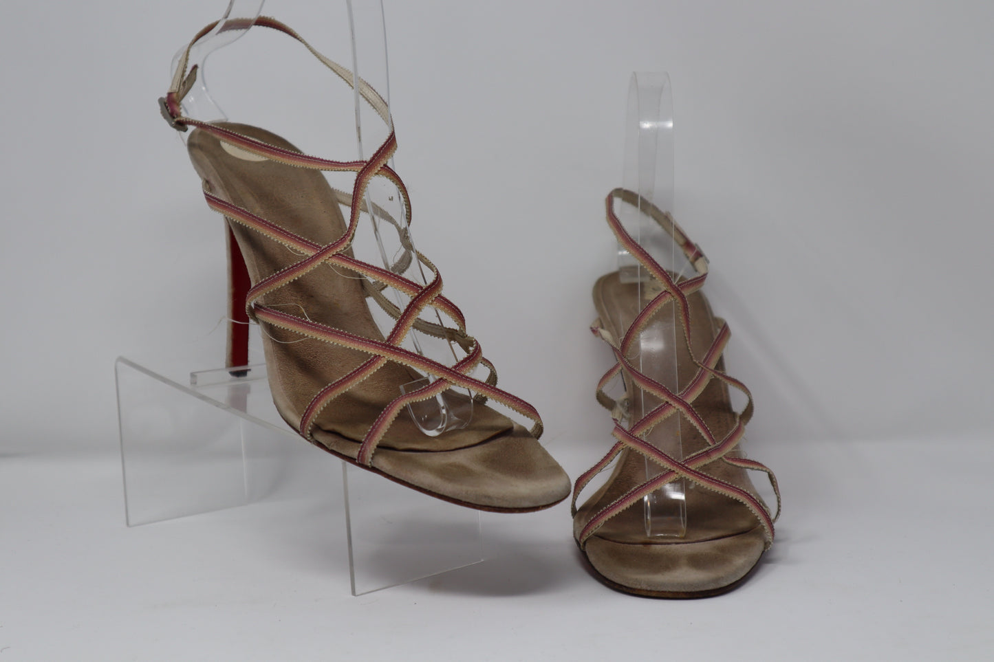 Christian Louboutin Sandals in fair condition, featuring leather straps and the signature red sole. These sandals require new heel taps but retain their elegant, designer appeal.