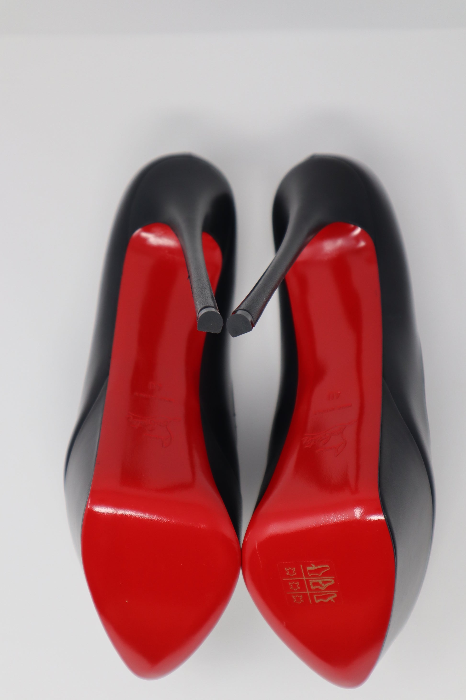 Christian Louboutin Shiny Calfskin Alta Vicky 160 Pumps featuring a towering 160mm platform heel and luxurious shiny calfskin leather with a round toe design. Finished with the iconic red sole for a bold and elegant statement.