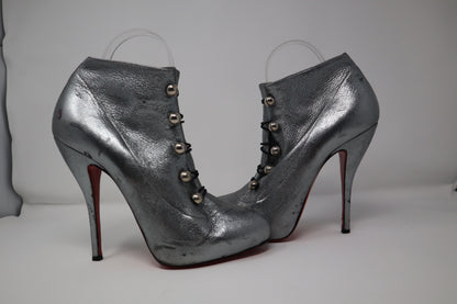 Christian Louboutin Leather Boots in fair condition, featuring premium leather construction with a pointed toe and high stiletto heel. Includes the iconic red sole and comes with a dust bag. Stylish and bold, perfect for adding designer flair to any outfit.