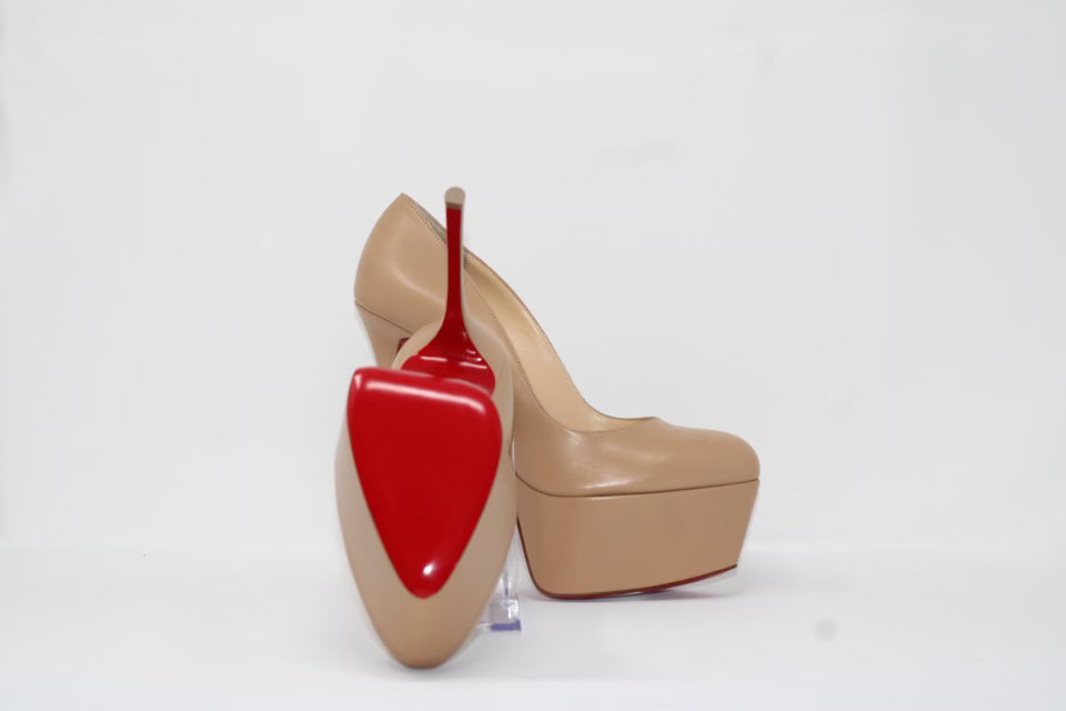 Christian Louboutin Shiny Calfskin Alta Vicky 160 Pumps featuring a 160mm platform heel with a round toe design. Made from luxurious shiny calfskin leather, these pumps include the signature red sole, offering bold height and style.