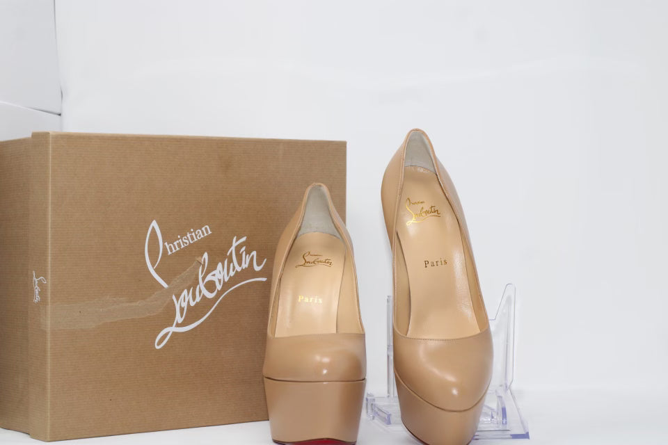 Christian Louboutin Shiny Calfskin Alta Vicky 160 Pumps featuring a 160mm platform heel with a round toe design. Made from luxurious shiny calfskin leather, these pumps include the signature red sole, offering bold height and style.