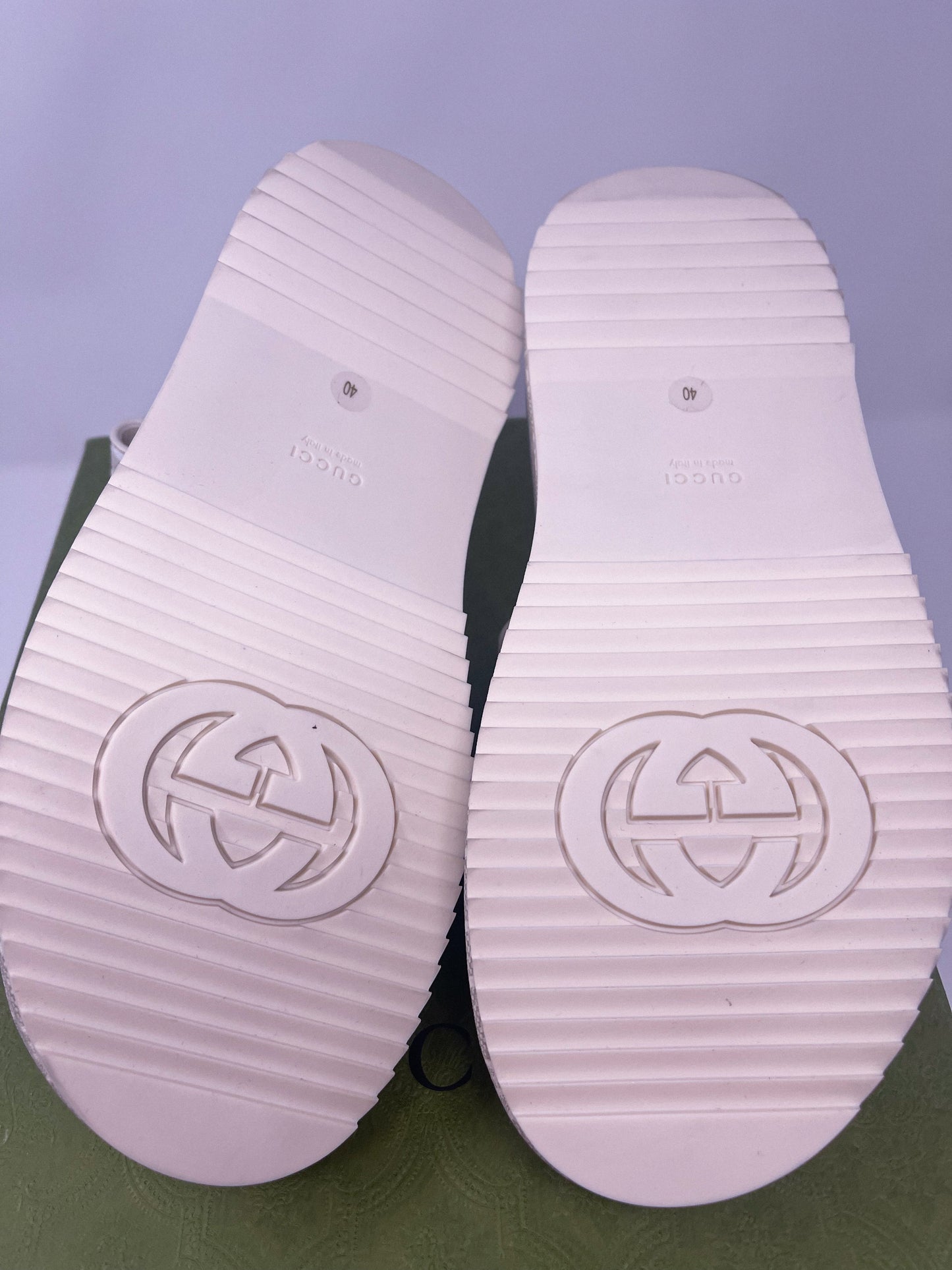 A luxurious pair of GG Supreme Monogram Angelina Platform 35mm Slingback Sandals in size 40. These designer sandals feature the iconic GG monogram pattern, a platform sole, and an elegant slingback design. Originally priced at $1300, they are now available for $300. The image highlights the intricate details and high-end craftsmanship, showcasing the perfect blend of luxury and comfort.