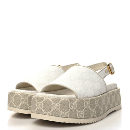 A luxurious pair of GG Supreme Monogram Angelina Platform 35mm Slingback Sandals in size 40. These designer sandals feature the iconic GG monogram pattern, a platform sole, and an elegant slingback design. Originally priced at $1300, they are now available for $300. The image highlights the intricate details and high-end craftsmanship, showcasing the perfect blend of luxury and comfort.